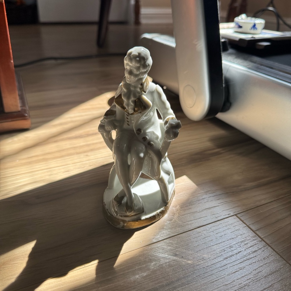Elegant Gold and White Porcelain Figurine